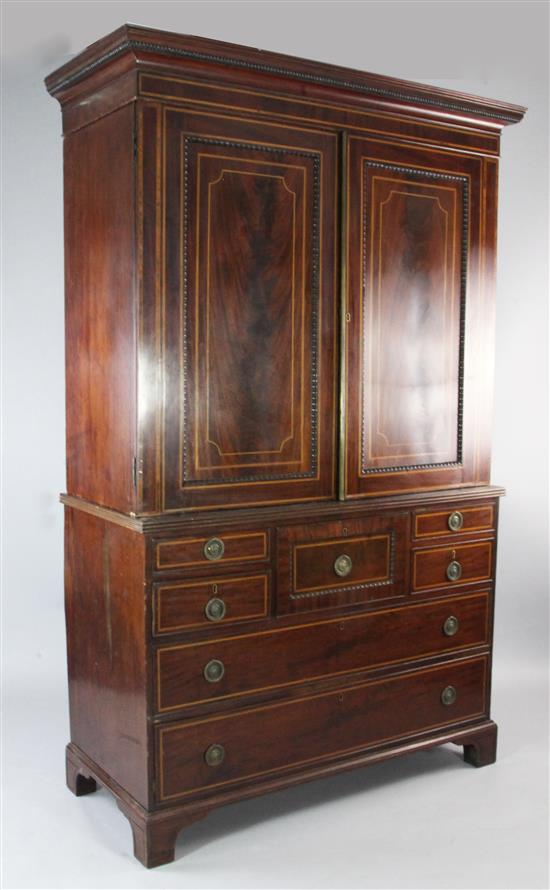 An early 19th century Scottish mahogany satinwood banded linen press, H.6ft 10in.